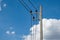 Electricity concrete post and high voltage wire at sky background