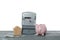 Electricity meter, house model, money and piggy bank on grey wooden table against white background