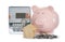 Electricity meter, house model, piggy bank and coins on white background