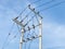 Electricity poles high power system and wires with blue sky