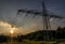 Electricity Pylon Against Sky During Sunset