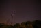 Electricity pylon against starry sky