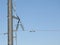 Electricity pylon, electric transmission tower, against the blue sky. Energy tower