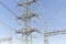 Electricity Pylon Industrial Electricity Towers On Blue Sky Afternoon