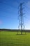 Electricity pylon in meadow