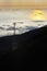 Electricity pylon over valley at sunset, Lomba das