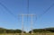 Electricity pylon power pole high voltage against blue sky