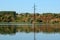 Electricity pylon stands in a lake