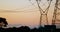 Electricity pylons during sunset 4k