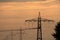 Electricity pylons in the sunset photographed