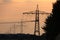 Electricity pylons in the sunset photographed