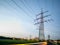 Electricity pylons at sunset transporting clean energy