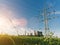 Electricity pylons at sunset transporting clean energy