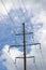 Electricity Supply Line Pylon Closeup, Cables, Bright Summer Cloudscape, Vertical Sky Clouds Background