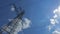 Electricity tower with high voltage metal with wires against the sky with clouds