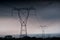 Electricity transmission power lines at sunset High voltage tower