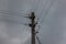 The electricity wooden pylon against a sky