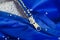 Electrified lightweight foam filler stuck to the zipper, hands, blue fabric