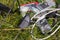 Electro-waste, Old telephones, LEDs, chargers, cables scattered in the grass. The problem of littering and degradation of the