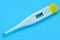 The electronic body thermometer displays a very high temperature of 39.9 Â° C Celsius on a blue background