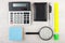 Electronic calculator and miscellaneous stationery tools on wood