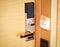 Electronic card smart lock on wooden door at the hotel for power.