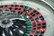 Electronic casino spinning triple roulette wheel close-up