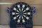 electronic dartboard on wooden background