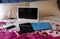 Electronic devices to work from home: laptop, phone and tablet on a bed