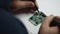 Electronic engineer soldering circuit perfboard