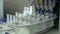 Electronic equipment in the laboratory with test tubes and syringes on the table close up. Drug manufacturing. Machinery