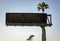 Electronic freeway sign in southern California stating Orange County Beaches Closed