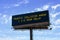 Electronic highway billboard with traffic collision delay warning