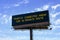 Electronic highway billboard with traffic collision delay warning