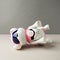 Electronic interactive toy dog puppy on a gray background, high technology concept, pet of the future, electronic home