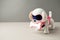 Electronic interactive toy dog puppy on a gray background, high technology concept, pet of the future, electronic home, copy space