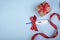 Electronic modern thermometer with a red bow and gift box