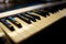 Electronic musical keyboard synthesizer close-up.