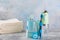 Electronic oral irrigator, toothbrush, paste, dental floss and mouthwash on background.