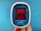 Electronic thermometer on a blue background.Medicine and health concept.Treatment of virus diseases