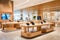 Electronics store interior combines sleek design and wooden elements, offering a spacious, well-lit space filled with