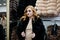 Elegance blonde girl in fur coat store