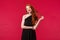 Elegance, fashion and woman concept. Gorgeous good-looking redhead young woman in black elegant dress, coquettish