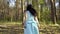Elegance girl in blue dress walks in forest, Snow White fairytale