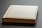 Elegance in Ivory: Handcrafted Faux Leather Wedding Album on Grey Background