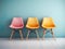 Elegance meets simplicity in this minimalist studio shoot of a beautifully designed room with three colorful chairs.