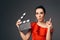 Elegant Actress in Red Dress Holding Cinema Clapboard