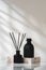 Elegant Aroma Diffuser With Black Reeds on a Marble Stand in Soft Daylight