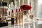 Elegant array of lipsticks on a vanity, with a crystal glass and a red rose adding a touch of luxury