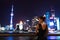 Elegant asian woman relaxing by the Bund skyline